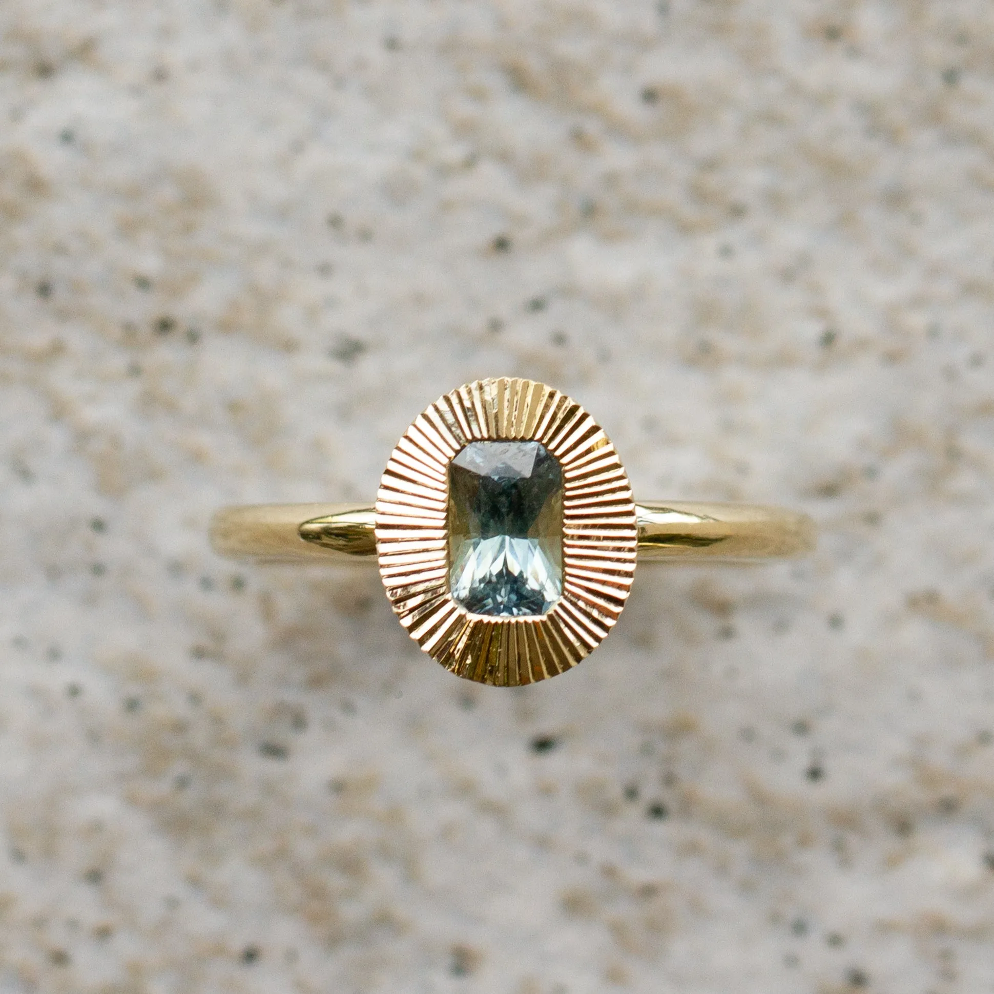 North-South Oval Aurora Ring with Blue Green Radiant Cut Montana Sapphire .69ct