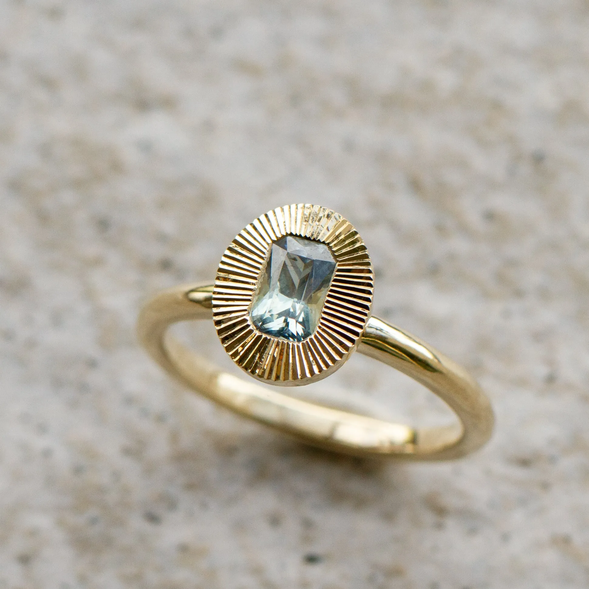 North-South Oval Aurora Ring with Blue Green Radiant Cut Montana Sapphire .69ct