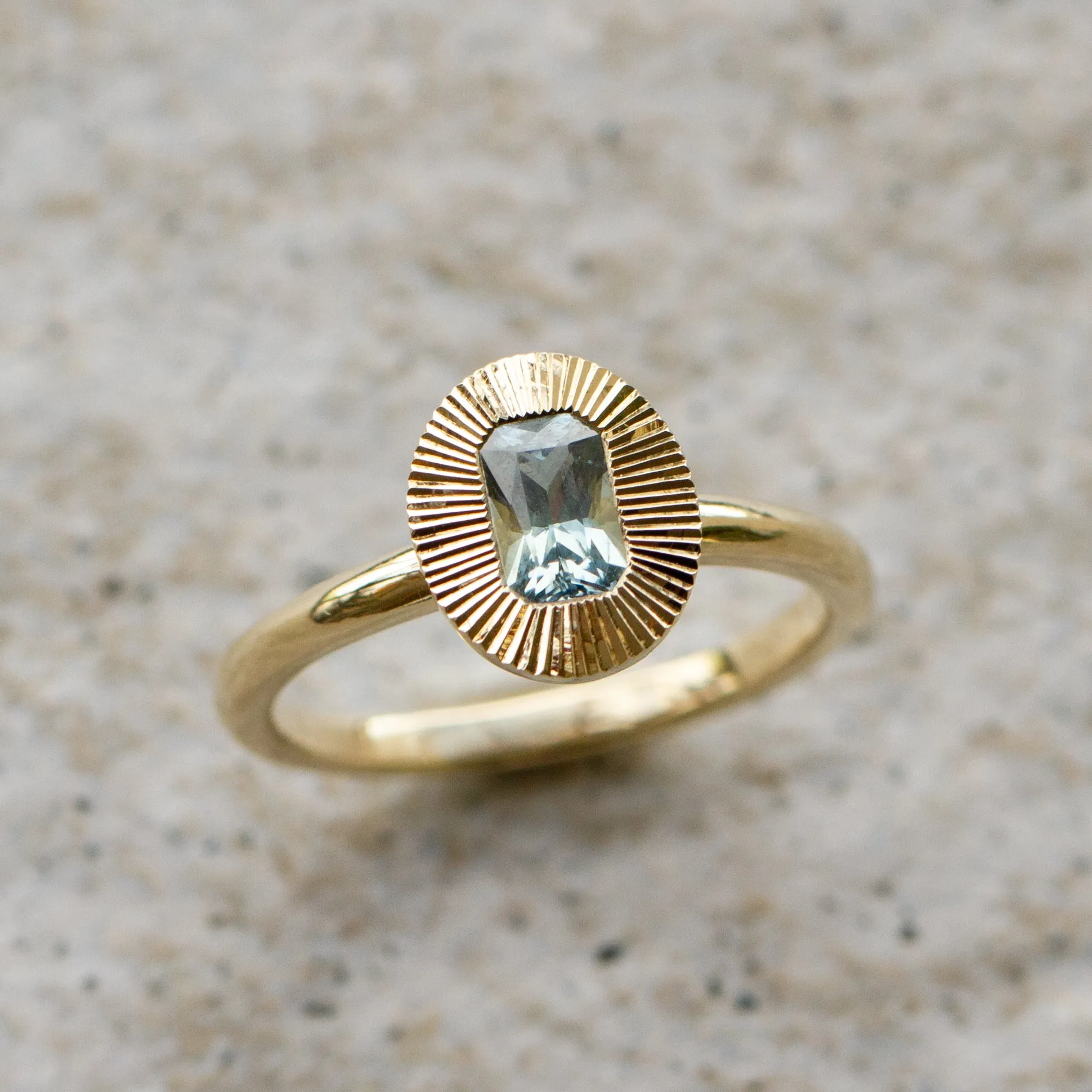 North-South Oval Aurora Ring with Blue Green Radiant Cut Montana Sapphire .69ct