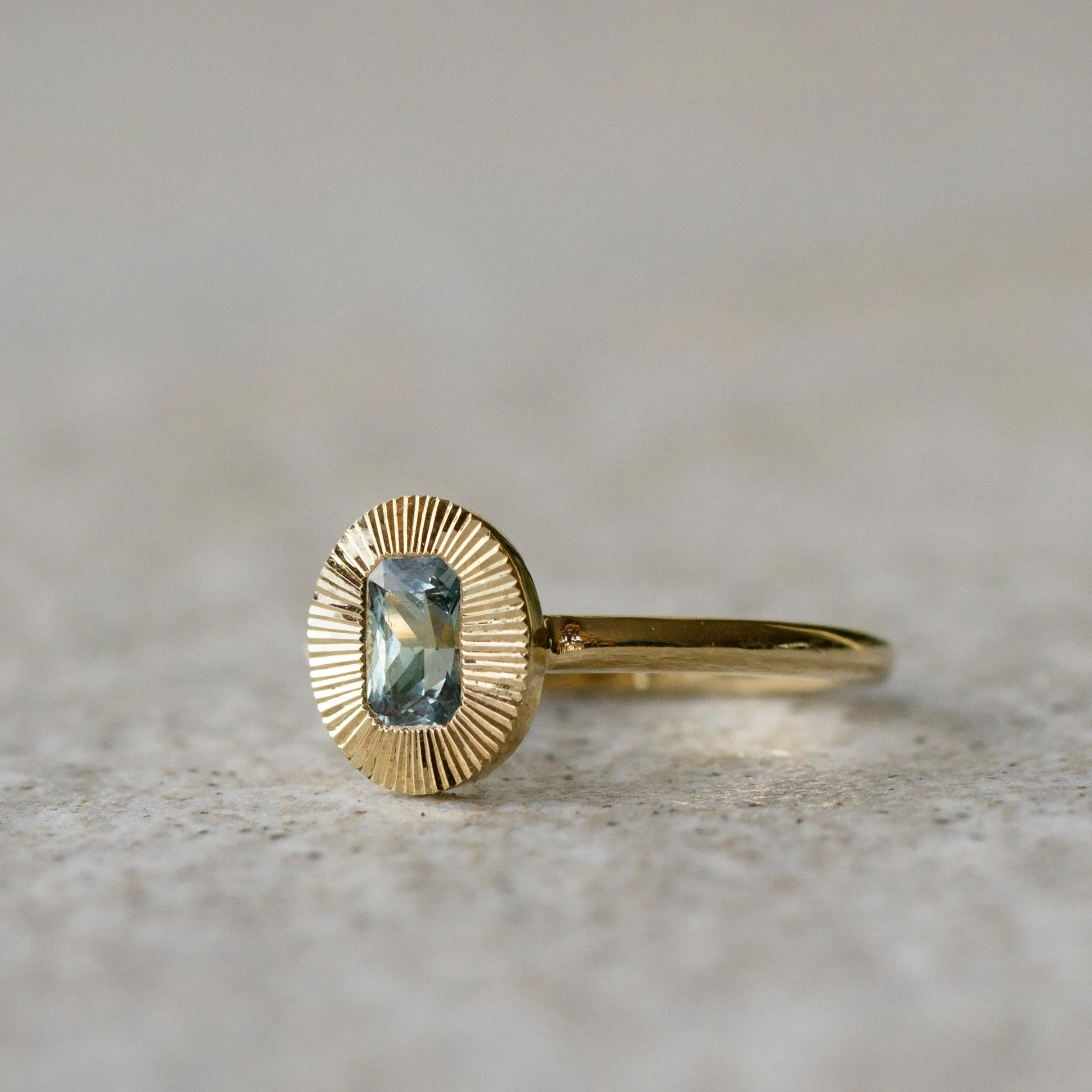 North-South Oval Aurora Ring with Blue Green Radiant Cut Montana Sapphire .69ct